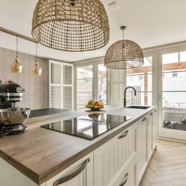 A contemporary kitchen with clean lines, ambient lighting, and elegant floral accents.